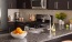 a kitchen with black cabinets